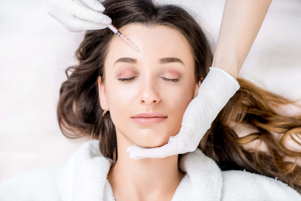 Young women receiving Daxxify at The Alchemy Clinic in Manchester, NH