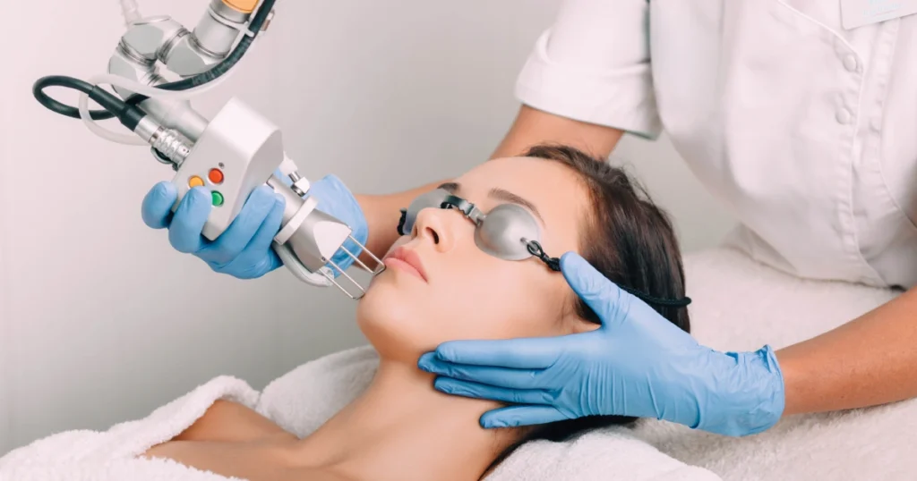 Young woman receiving CoolPeel laser treatment in Manchester, NH for glowing skin