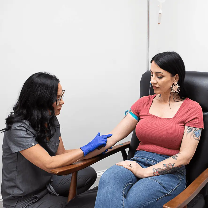 Female receiving IV Therapy for health and wellness at The Alchemy Clinic in Manchester, NH