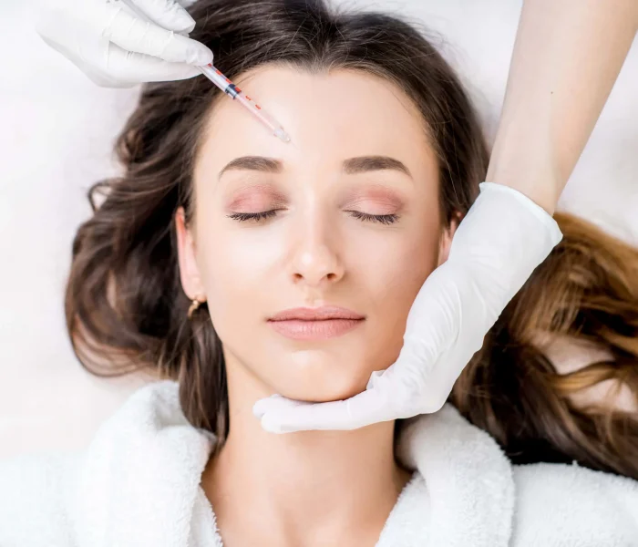 Young women receiving Daxxify at The Alchemy Clinic in Manchester, NH